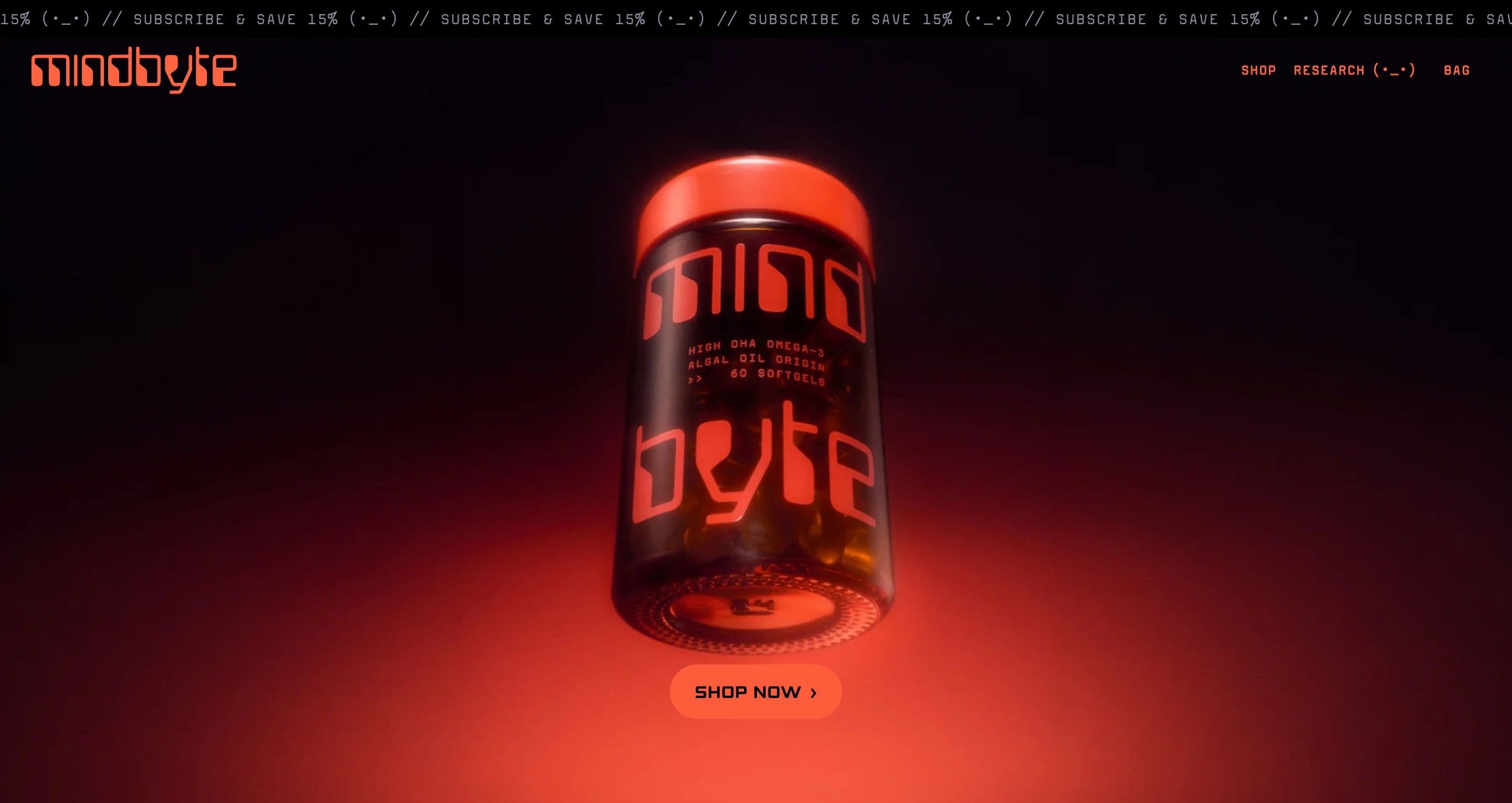 The home page hero on mindbyte.com, the red-lidded omega-3 jar glowing in red light above a shop now button