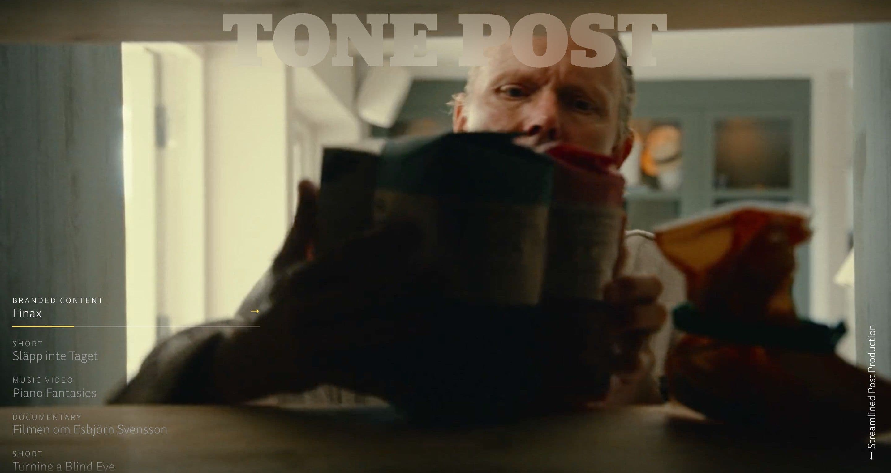 The home page on tonepost.se, with a man peering over a snack bag from the Finax branded content behind the list