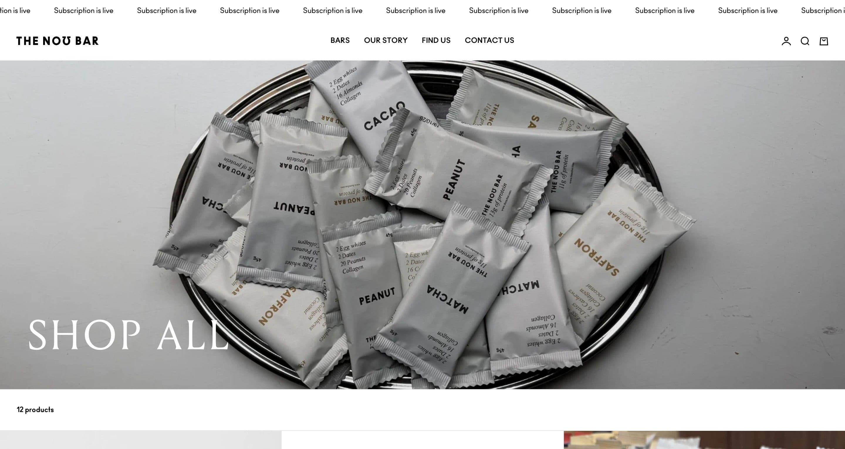 The shop all page on thenobar.com, wrapped protein bars piled on a silver tray